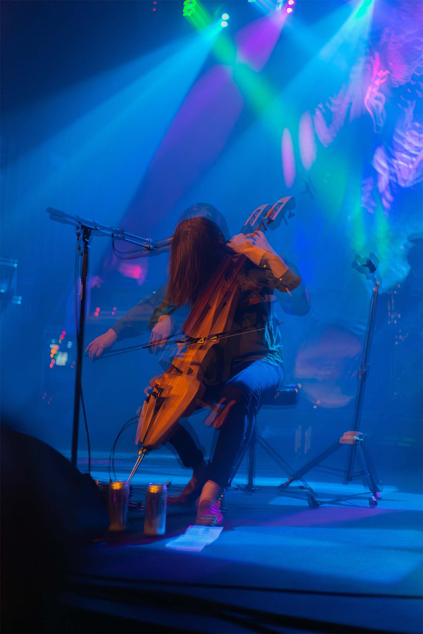 Cursive — cellist motion blur blue