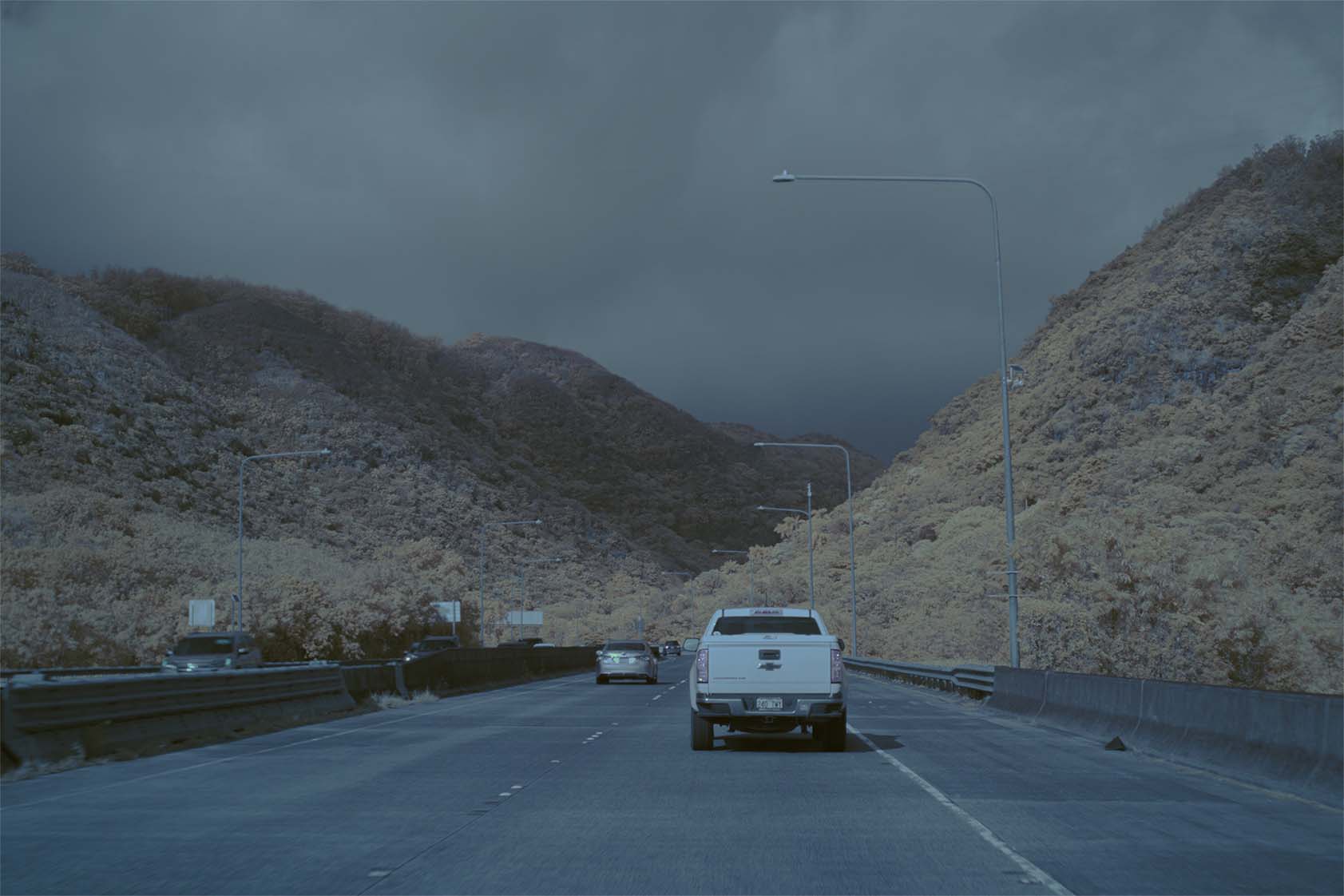 Moonside — Colorado teal sky yellow-green pines rocks