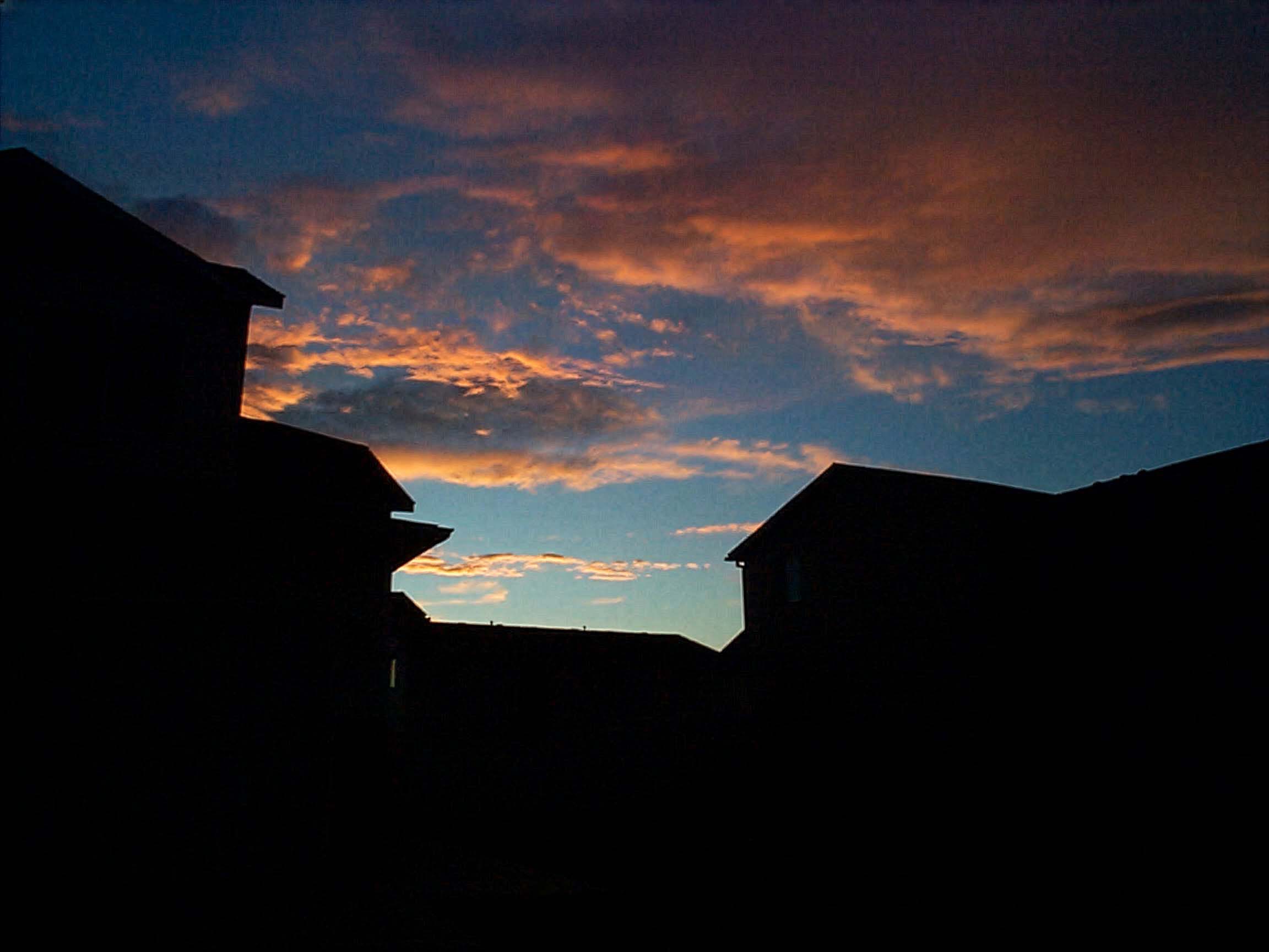 QuadraCam — suburban sunset silhouette orange clouds